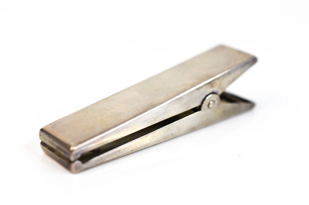 Vintage Charles Thomae Sterling Large Paper Clip: Includes a Charles Thomae "Hanging Fire" large sterling paper clip, weighs 1.38OZT, measures approx. 83.7mm long.