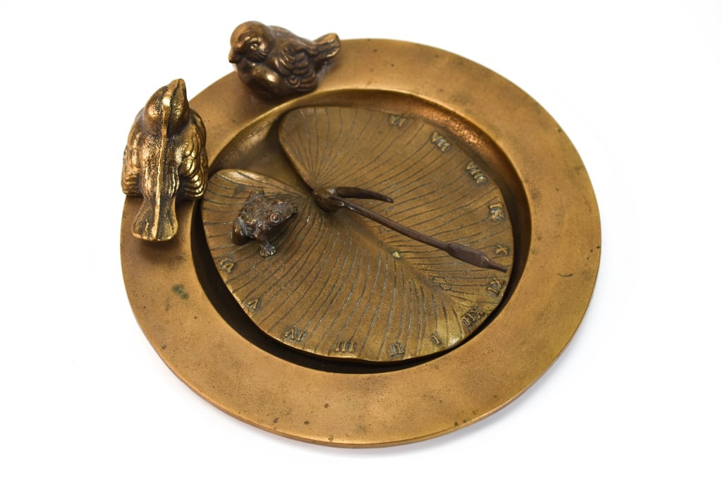 White Swan Bronze Bird Bath & Brass Frog Sundial: Includes (2) pieces including a White Swan bronze bird bath, marked on bottom with the date 1983; also includes a White Swan brass frog lily pad sun dial marked on bottom with the date 1986. Pieces ar