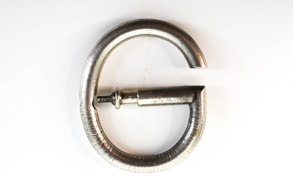 Vintage Gucci Sterling Silver Buckle: Hallmarked Gucci "925" Italy, appears to be in working condition, shows age and wear commensurate with use; unsure if it is a buckle, snaffle, bit, or key ring. Weighs approx. 17.2 grams. Provenance: