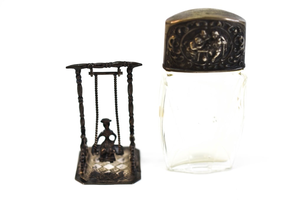 Sterling Holland Mini Swing & Perfume Bottle: Includes a glass perfume bottle with sterling cap and a miniature Holland sterling swing with child. Total weight is approx. 31 grams, not including glass bottle. Swing is marked with Holland and an u