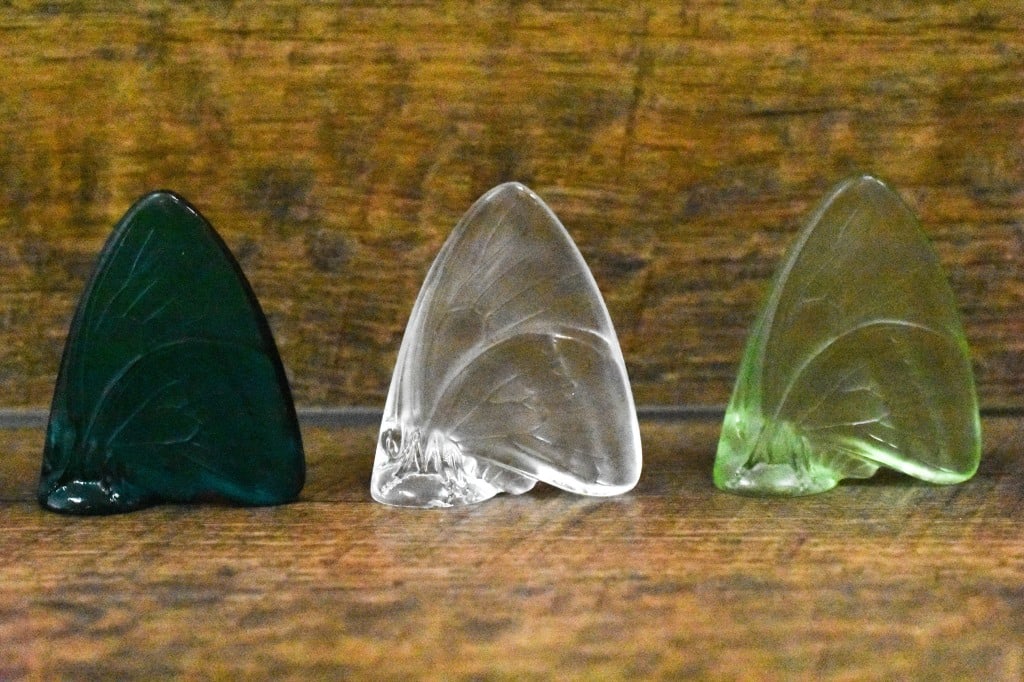 Lalique Crystal Butterfly Figurines: Includes 3pcs: Lalique Crystal Butterfly Figurines In Blue, Green and Clear. Signed. Approx. dimensions W: 2" H: 2 1/4".