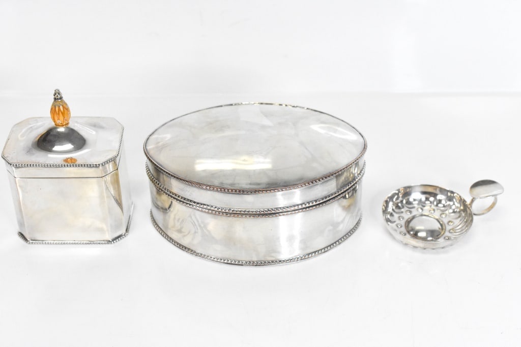 French English Silver Plate Boxes / Caddie & More: Includes 3 pcs: 1 biscuit box. (shows some wear around edges). Unidentified hallmarks. 1 Tea caddy with cover. English. 1 Wine taster, tastevin. Unidentified French hallmarks. Largest piece L 6 1/2".