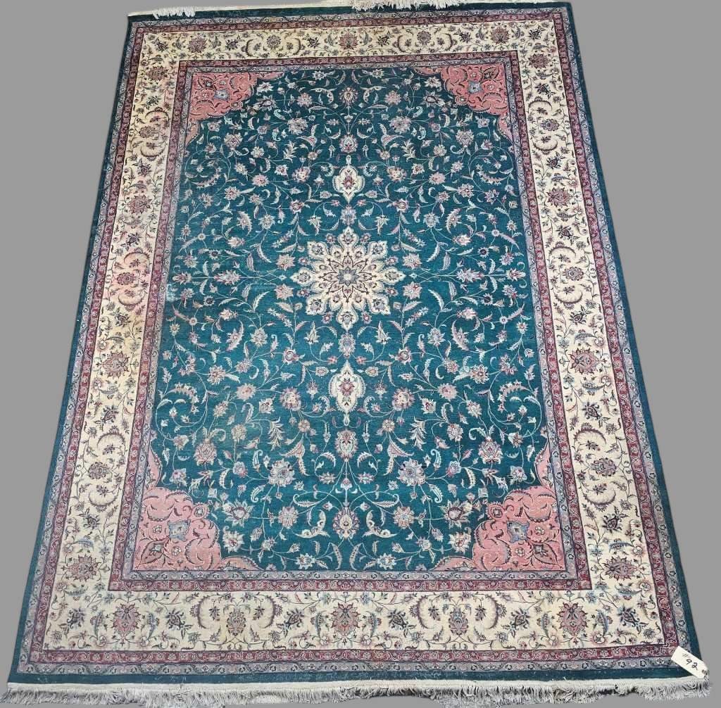 Indo Turkish Green & Cream Silk Rug: Measures approximately 12' 10" x 8' 11". Shows some wear. Color does run in one area. Has some moth damage along edges of rug.