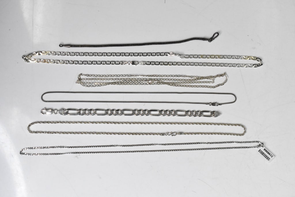 Sterling Silver Link Necklaces, Bracelets Jewelry: Includes: 5 chain link necklaces, 1 Cuban and 1 mesh bracelets. Approximate total weight 74.3 grams. Longest necklace measures approximately 28 1/2".