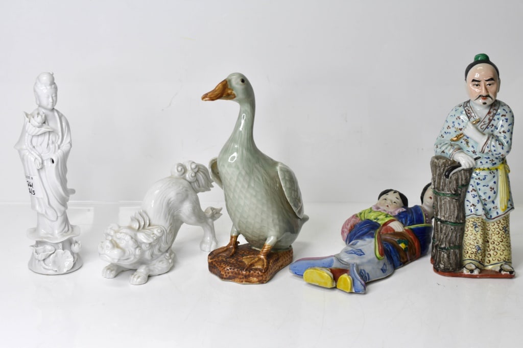 Chinese Porcelain Figurines: Includes: 1 Chinese Blanc de Chine Guan Yin Porcelain Figurine. 1 Chinese porcelain Duck figurine. Signed. 1 Chinese porcelain Famille Rose Figure of a man. Signed. 1 Fitz and Floyd Chinese porcelain