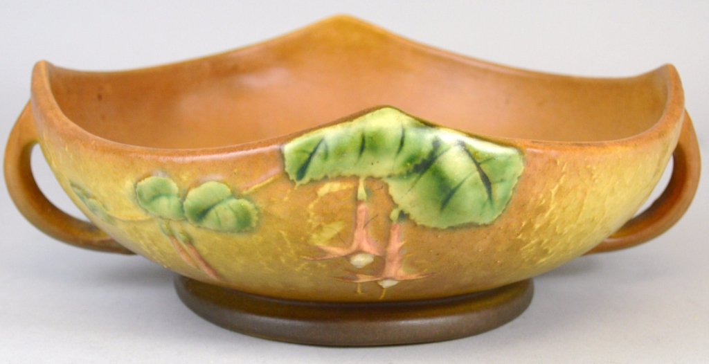 Roseville Fuchsia Handled Bowl: Roseville Fuchsia Handled Bowl, incised roseville mark, measures 9" h x 3" w