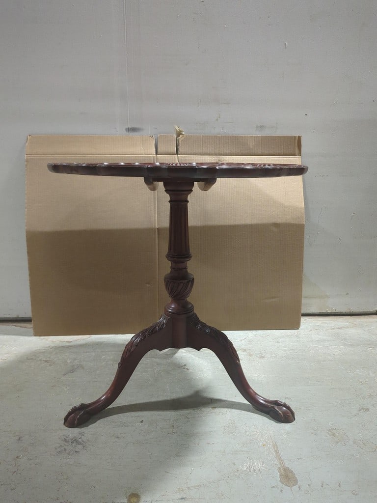 Chippendale mahogany tilt top table: Ball and claw feet shell carved carved knees, measures 44.5 in tall when tilted up diameter of table 29 in height of table 28.5 in