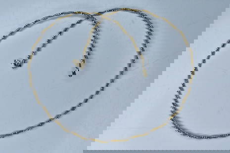 14K Royal Chain Gold Wire Necklace 7.5 Grams: A fine necklace, two tone, semi-wrap wire with a textured or scaly pattern. Weighs 7.5 Grams and in length Condition: Clasp at one end is pulled loos on the White gold portion, seems like an easy fix