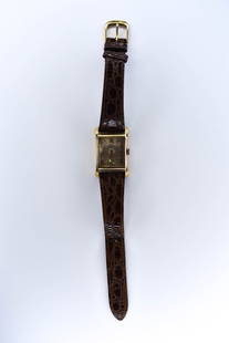 14K Yellow Gold Elgin Men's Wristwatch: The watch retains an old leather band in usable condition. Interior movement marked R353722 and 21 Jewels. It is in working order at the time of inspection. Spring winds nicely and freely. Dial faded