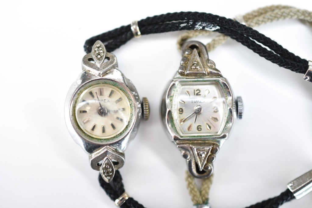 Rhodium Plated Art Deco Lady's Timex Wristwatches: Rhodium plated and stainless steel, cord bands, not tested for working condition.