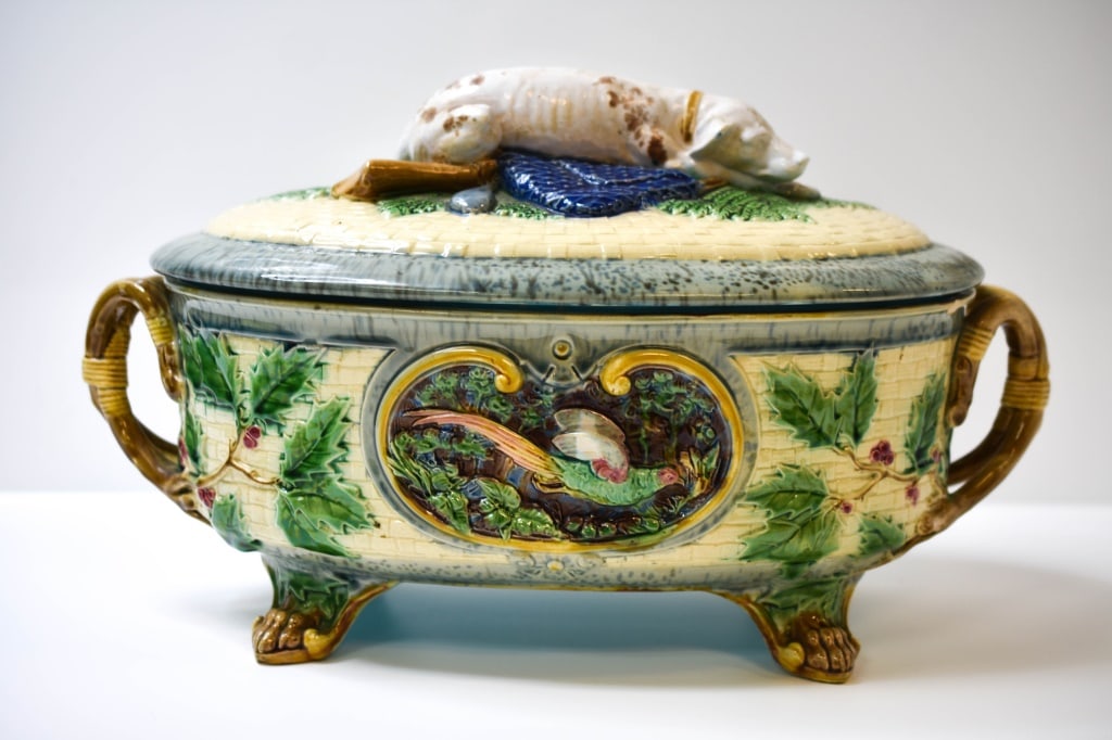 Minton Majolica Game Pie Dish / Tureen & Cover: A richly detailed and highly collectible Victorian majolica game pie dish and cover by Minton, one of England’s most renowned ceramic manufacturers of the 19th century. This oval, footed dish is ado