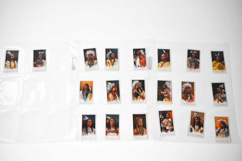 24 1930 British American Tobacco BAT Indian Cards: Full name of the cards are Types of North American Indians. Numbers are 1 to 20. With duplicates of 2,6,13 and 17. Cards can show rounded corners, worn corners, edge wear, discoloration on the back, c