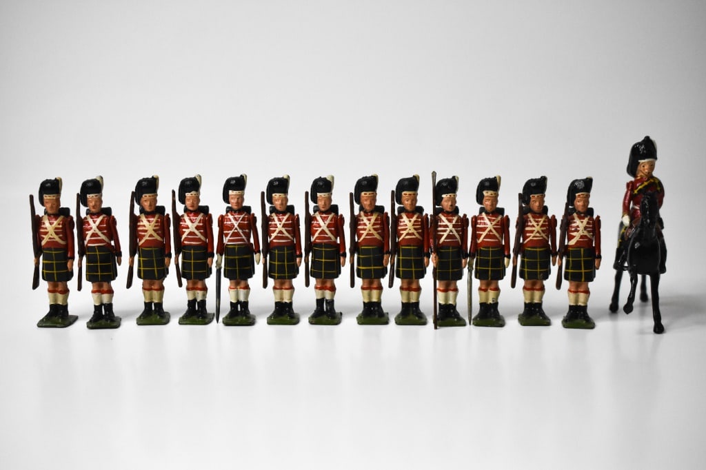 Britains Lead Highlanders: Roughly 2.25 inches tall. 10 with rifle at attenion, 2 officers with swords, 1 with pole, and 1 mounted. Some paint loss in areas.