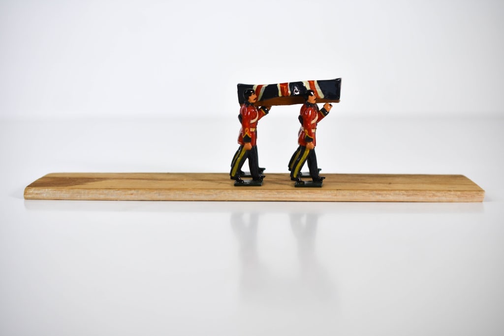 Britains Lead British Army Stretcher Barers: Wounded & Nuns; Roughly 2.25 inches tall. Paint loss in areas. Casket bearers are glued to the wooded board. Casket is closed.