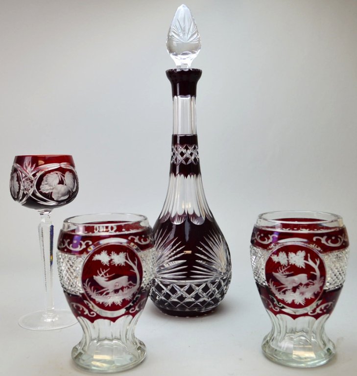 Unsigned Val St. Lambert Lot With Vignettes: Red cut to clear glass lot to include a decanter which measures 16, (2) tumblers, which measure 6." and (1) piece of stemware which measures 8.5""
