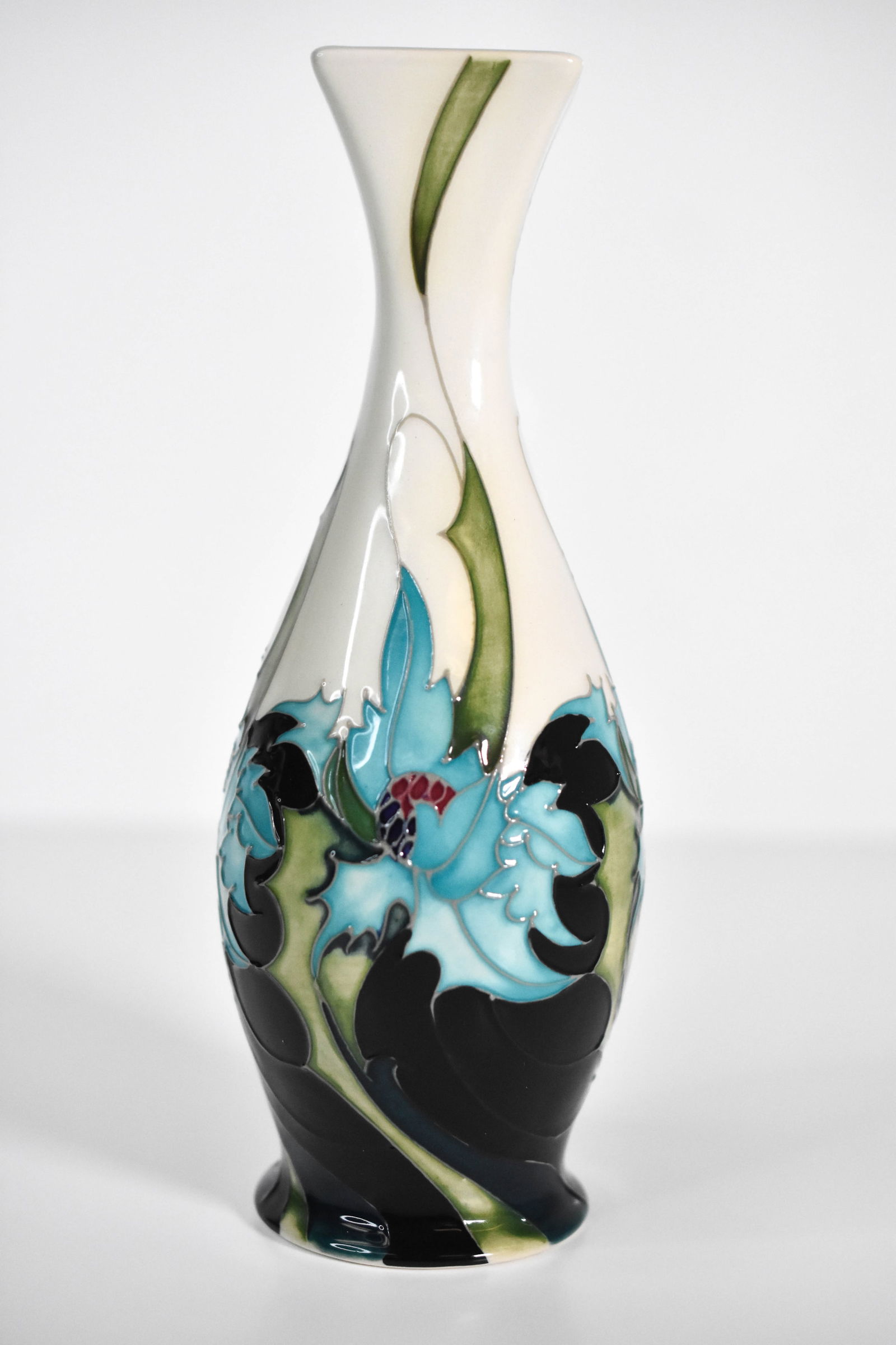 Moorcroft Vase, "Sea Holly" 2006: A Fine Moorcroft vase in the "Sea Holly" pattern. Brightly colored. Signed and marked Stoke on Trent, England with other markings. Dated 2006 Measures 8.75" tall