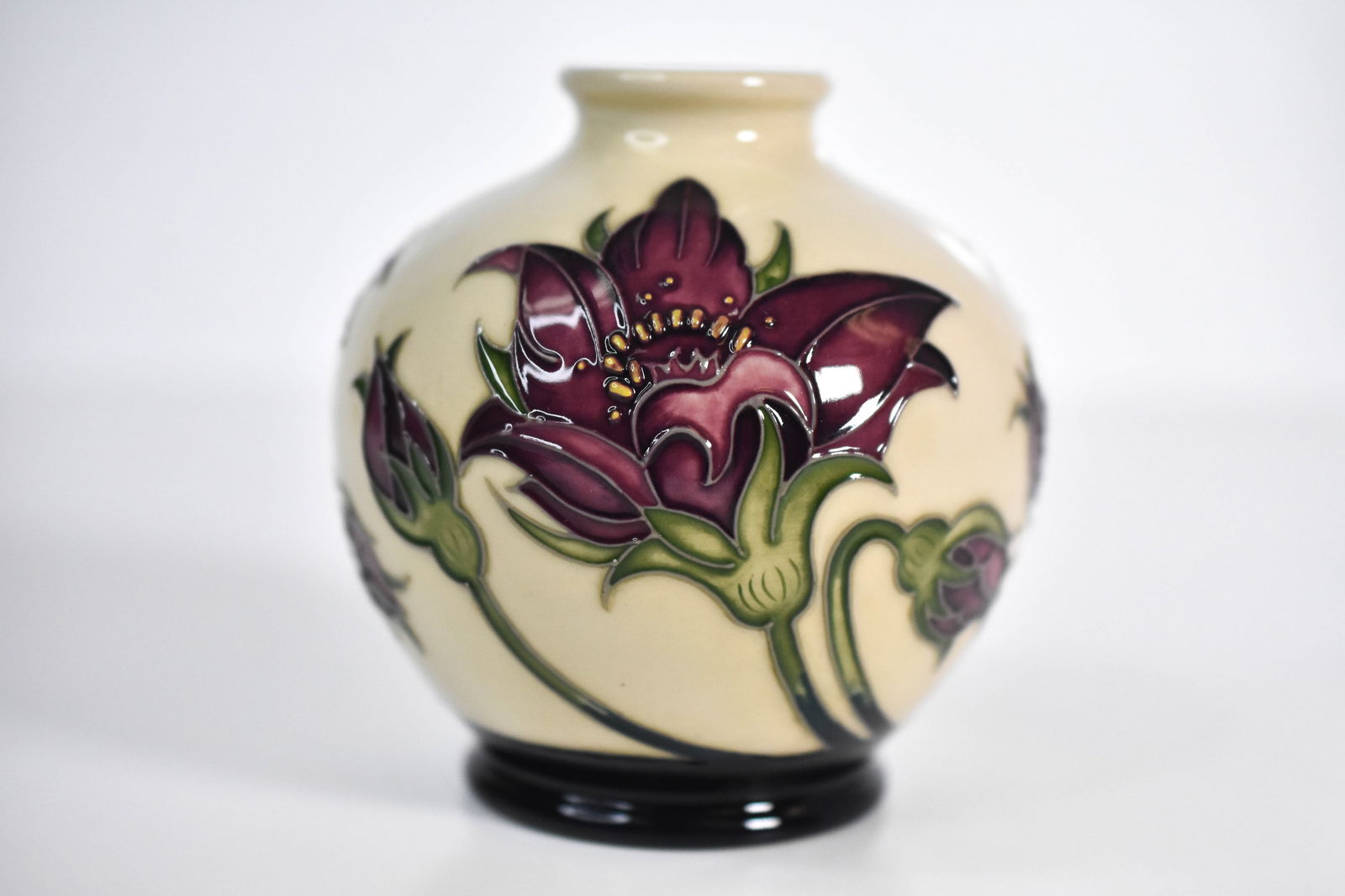 Moorcroft “Pulsatilla?? Vase by Vicky Lovatt 2010: "A beautifully crafted Moorcroft pottery vase designed by Vicky Lovatt, featuring the elegant “Pulsatilla” (Pasque flower) design. The spherical form is richly decorated with hand-painted