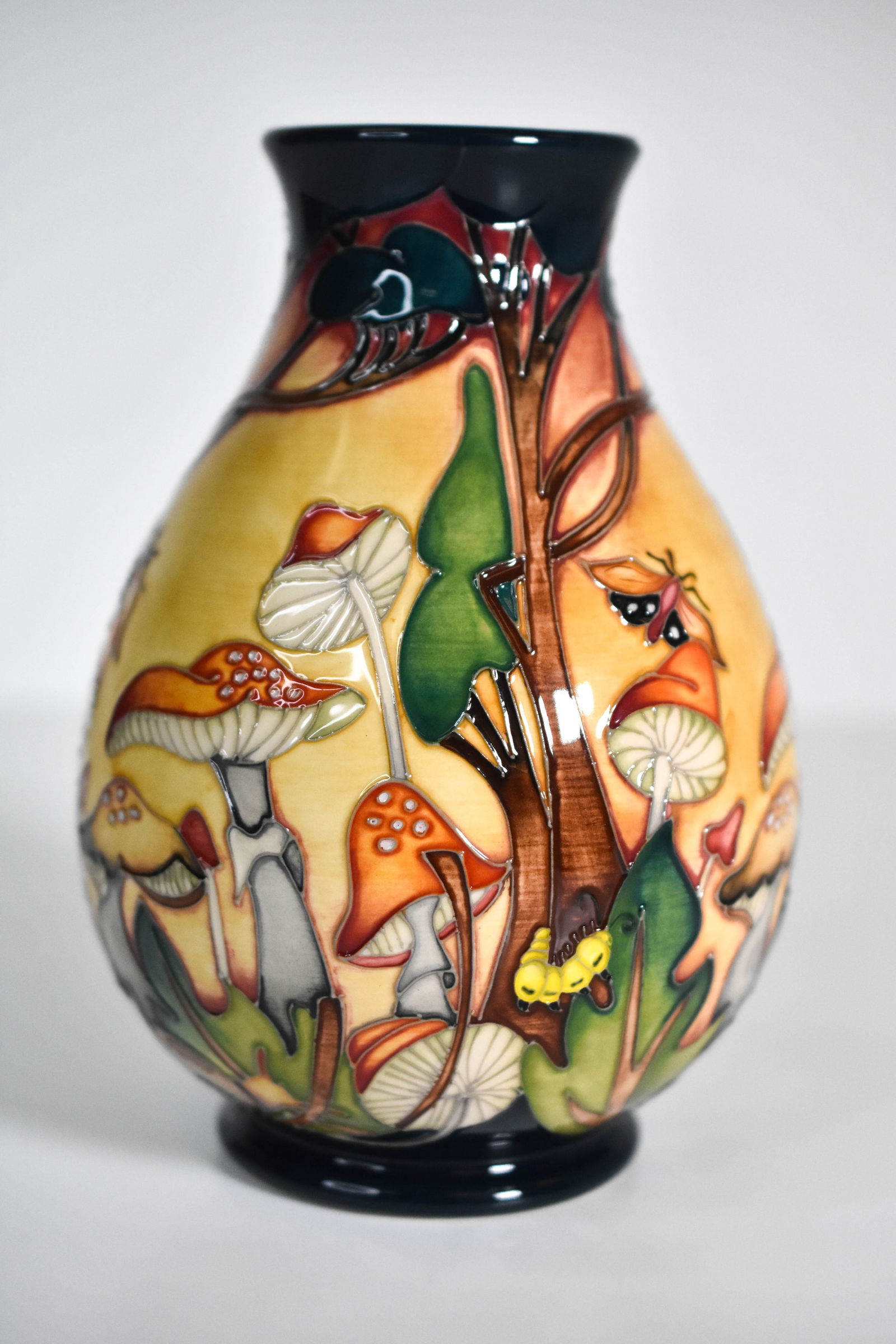 Moorcroft “Forest Floor?? Vase by Nicola Slaney: "A beautiful and highly sought-after Moorcroft vase designed by Nicola Slaney, titled "Forest Floor.?? This exceptional piece captures the rich textures and earthy tones of woodland flora through
