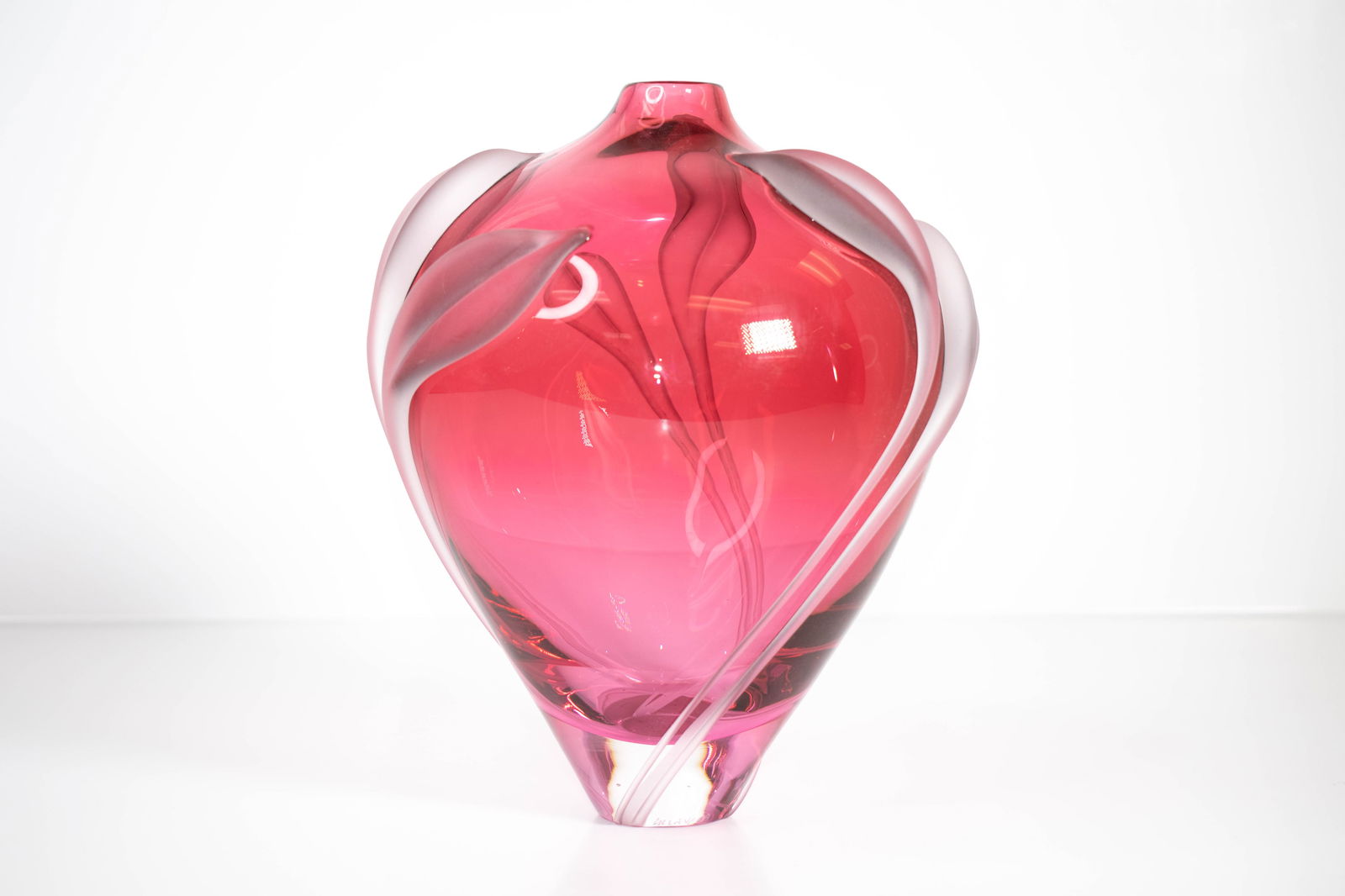 Miloslav Klinger Pink Art Glass Vase: A beautiful art glass vase by renowned Czech artist Miloslav Klinger, crafted in vibrant rose-pink glass with an elegant etched lily of the valley motif. The design features softly sculpted, organic c