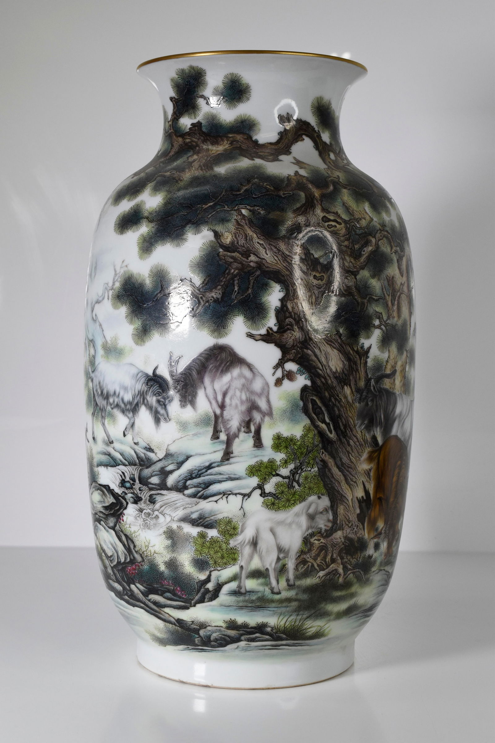 A Fine Chinese Vase Qianlong Seal Mark: A fine Chinese vase decorated with Goats, Mountains and other foliage. Bearing the the Qianlong seal mark. Paper label or tag stating previous Getty Collection. Circa 1950-1970.