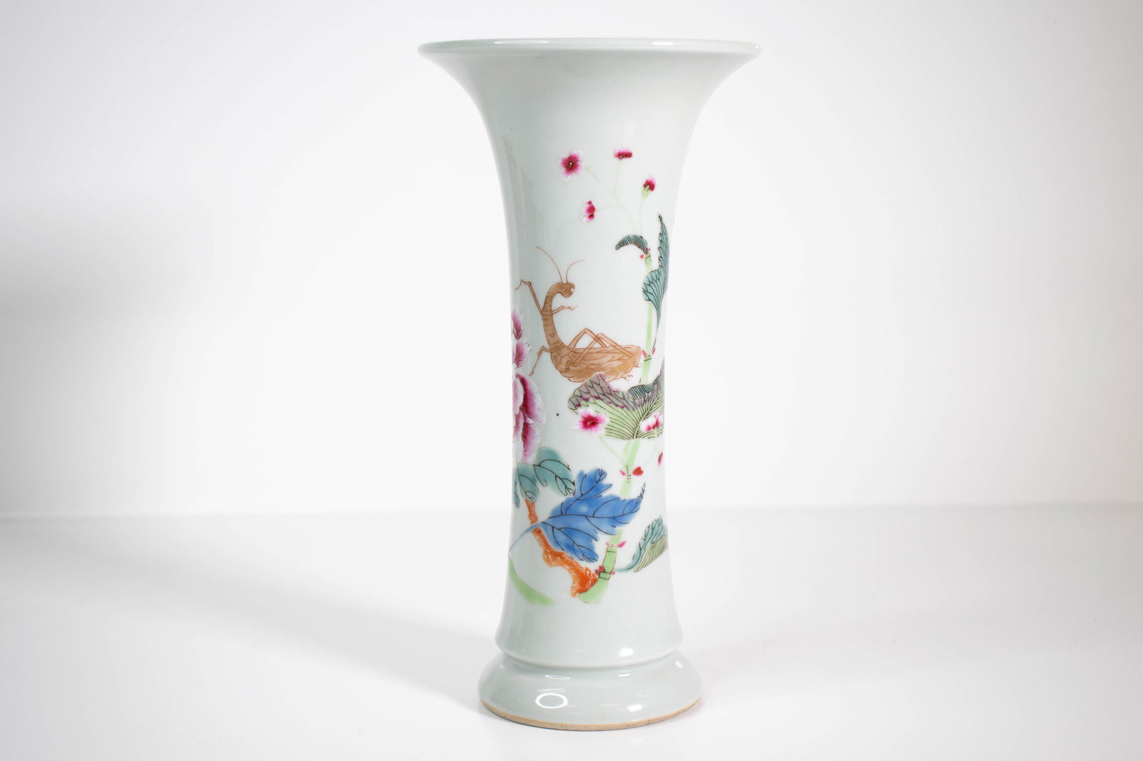 A Fine Chinese Vase: A fine Chinese Porcelain vase decorated with flowers, foliage and praying mantis Height 8.5" ****We Offer In-House Shipping***