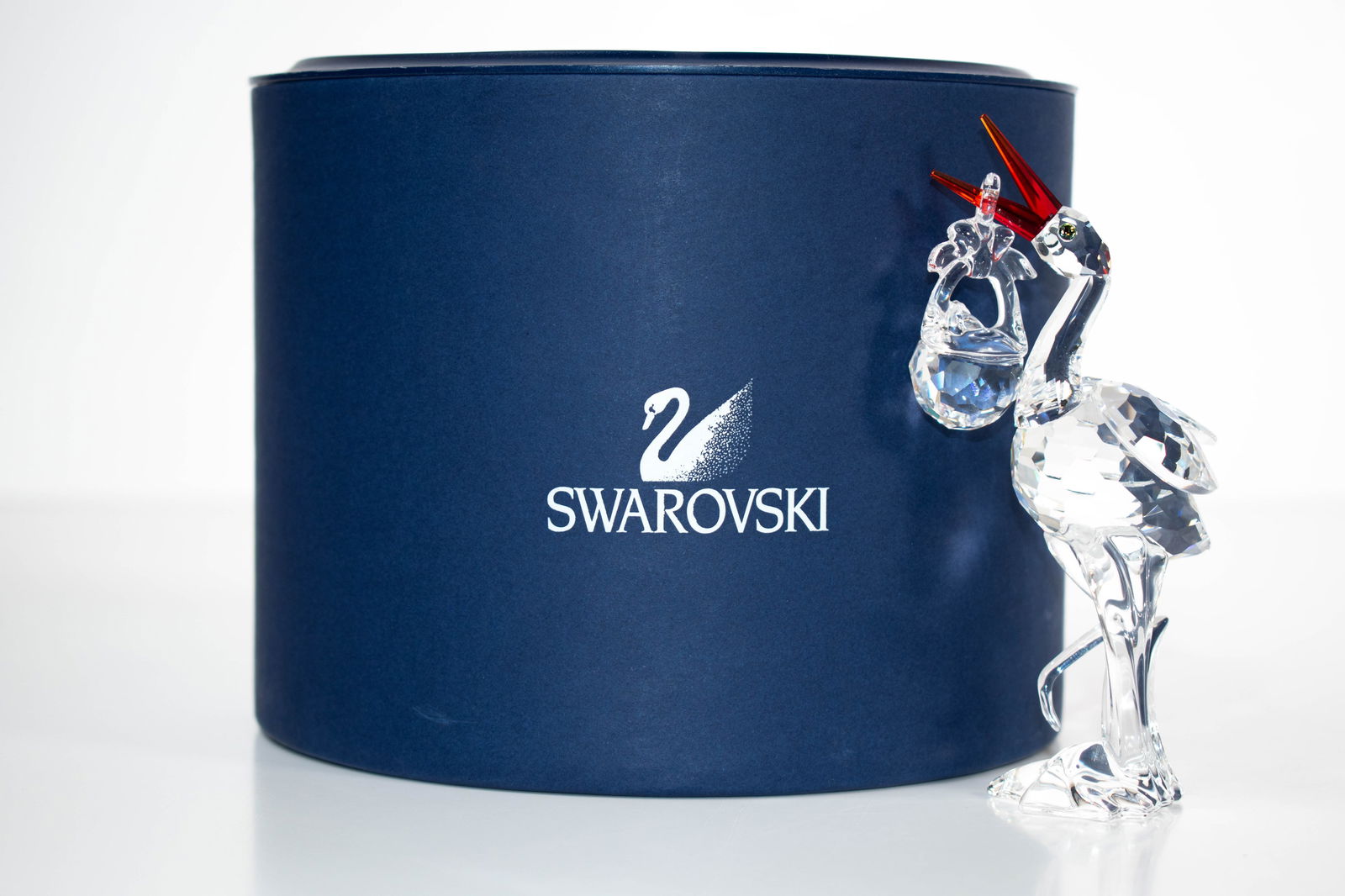 Swarovski Stork Bird w/Baby in Basket Figurine: Swarovski Stork Bird w/Baby in Basket Figurine 659401 Cheerful Times Approximately 5"H ****We Offer In-House Shipping***