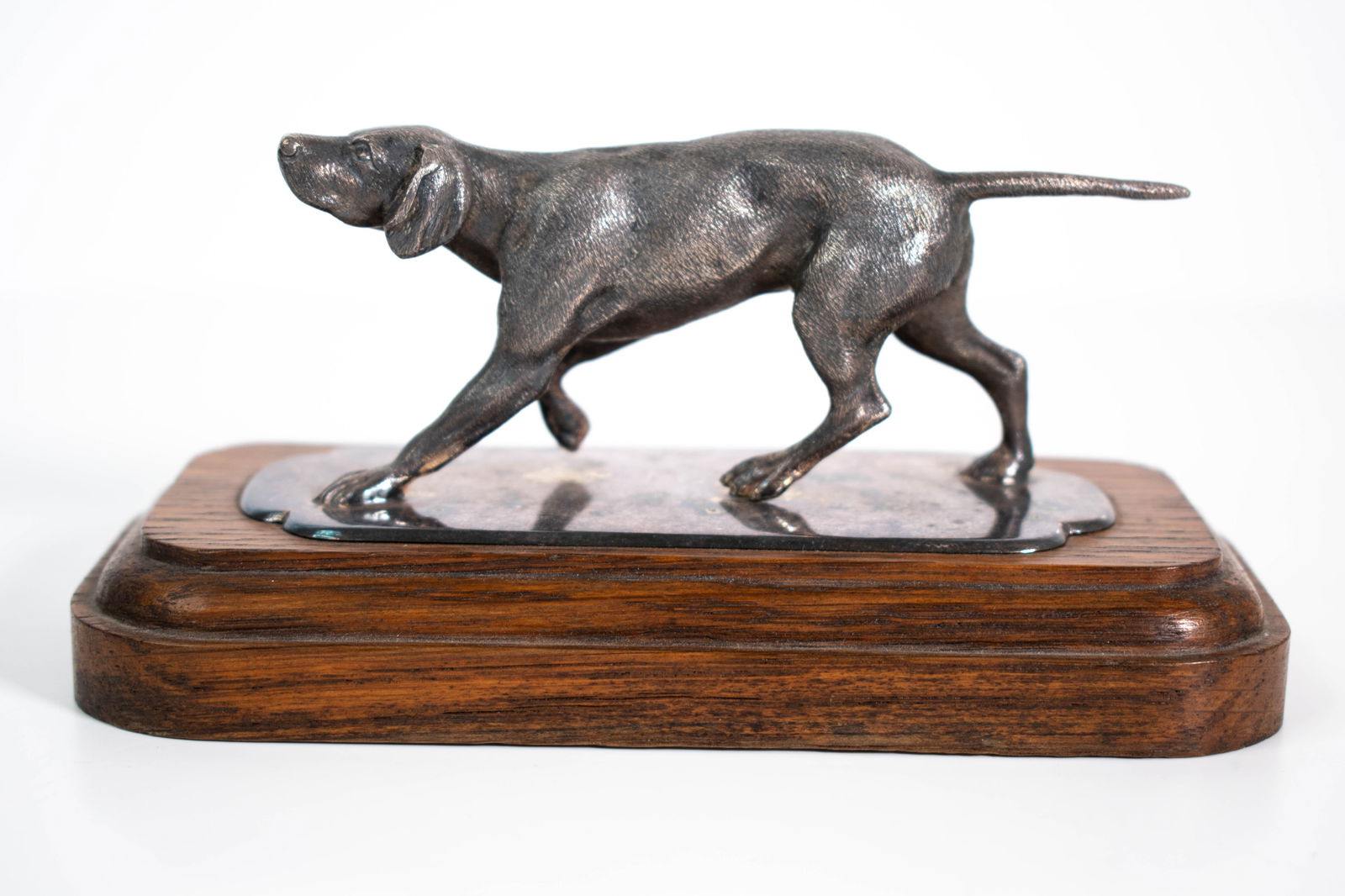 Silver Sculpture of a Pointer on a Wood Plinth: A nicely executed sculpture of a pointer. non sterling