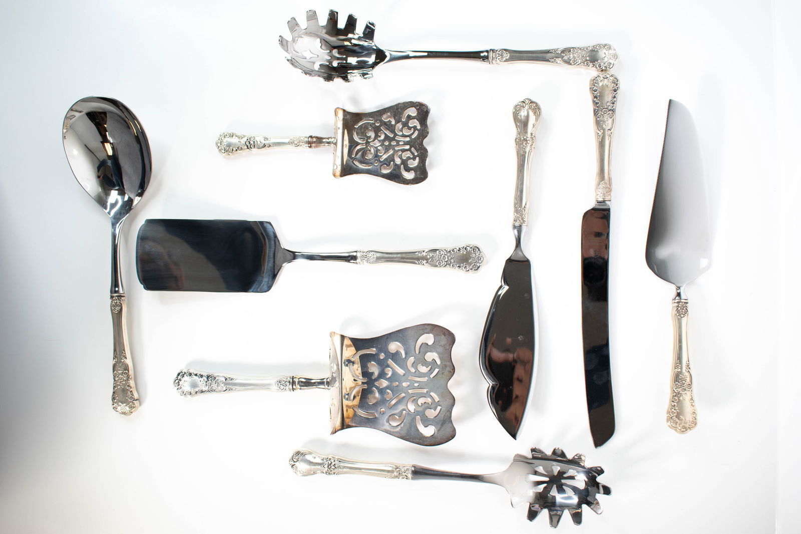Sterling Silver Handle Serving Utensils: Set of 9 Sterling Handle Serving Utensils, Includes Gorham Elegant mixed collection of nine sterling handle serving utensils, including examples by Gorham and other makers. The set features a variety