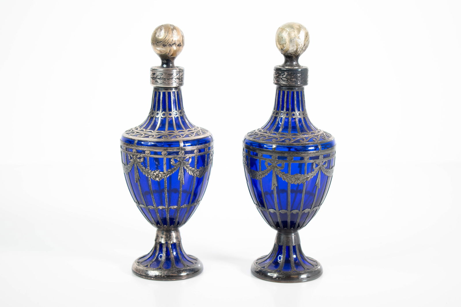 Sterling Overlaid Cobalt Glass Cruets (Bohemian): A fine pair of cobalt blue and sterling silver bottles or cruets in the Bohemian style. . Height 7" ****We Offer In-House Shipping***