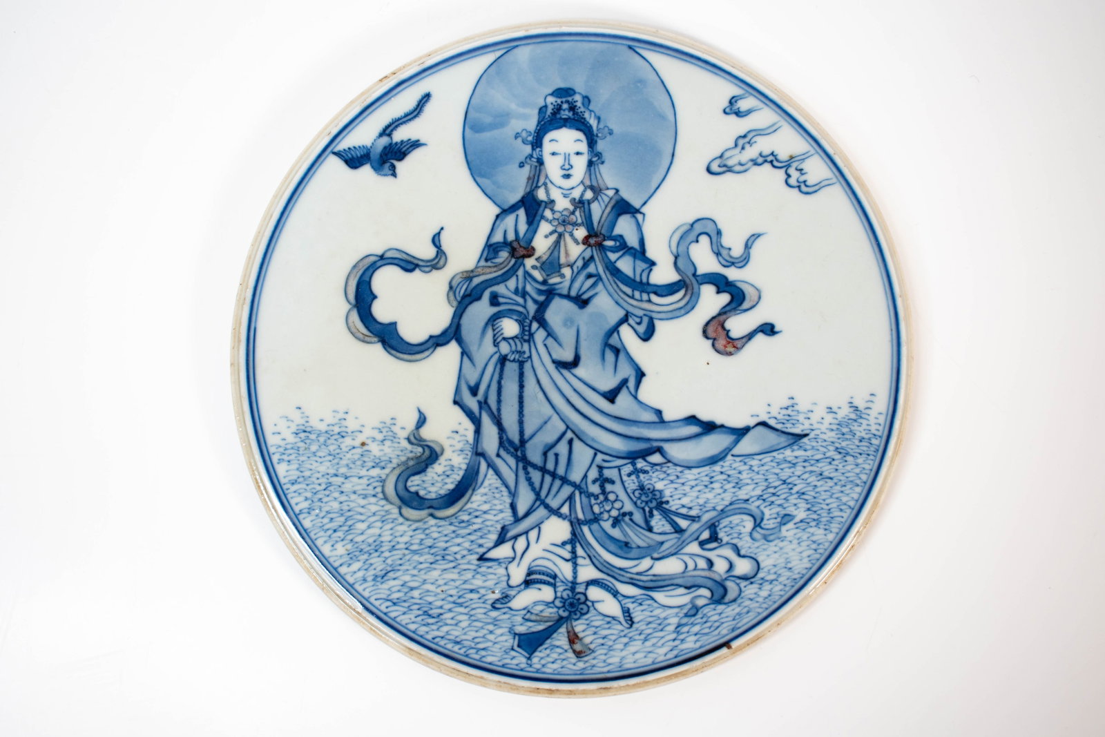 Chinese Porcelain Plate or Small Charger: A fine blue on white plate with a figure of Guanyin a Bodhisattva of compassion in Buddhism Width 9" ****We Offer In-House Shipping***