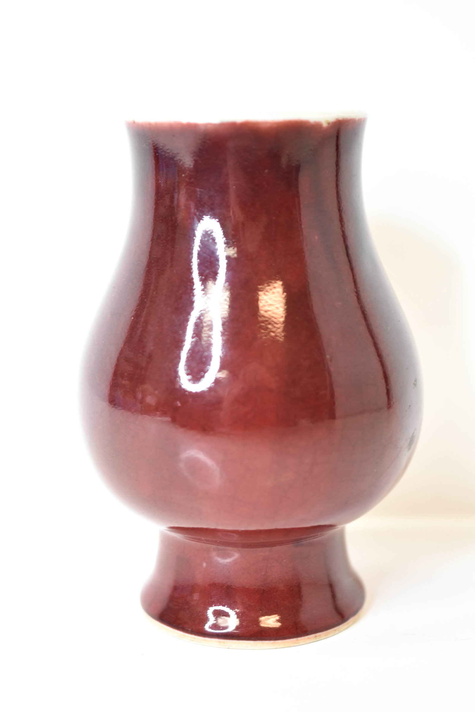 18th Century Chinese Oxblood Sang De Boeuf Vase: Includes an 18th century Chinese oxblood Sang de Boef porcelain vase There does not appear to be any chips, cracks, breaks, or repairs. measuring approx. 4" in diameter (approx. 2.5" at the opening) a