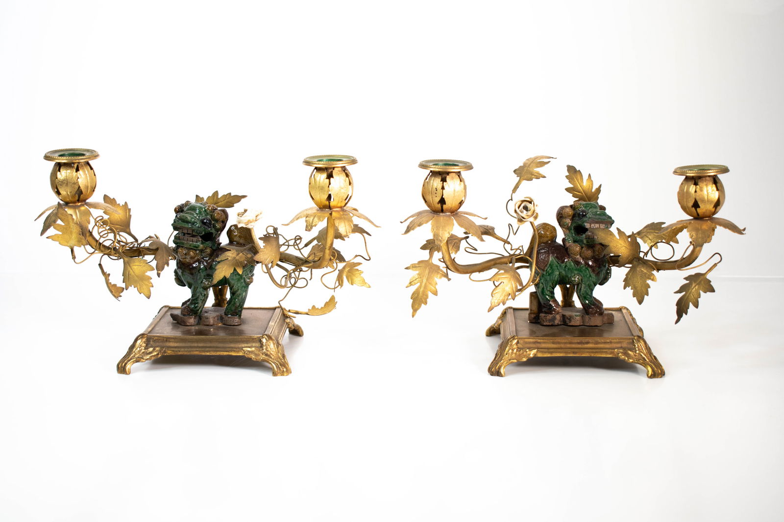 Chinese Foo Dog Porcelain & Gilt Candlesticks: Nice Chinese candlesticks with temple roof tile style foo dogs or lions on gilt metal bases Length 11.5" ****We Offer In-House Shipping***