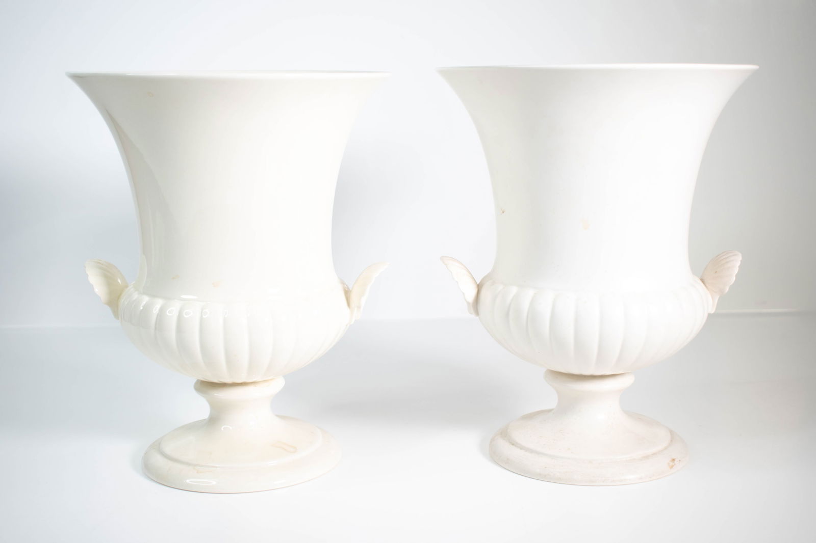 Wedgewood Porcelain Urns England: A fine pair of Wedgewood urns or garnitures, England Height 9.5" ****We Offer In-House Shipping***
