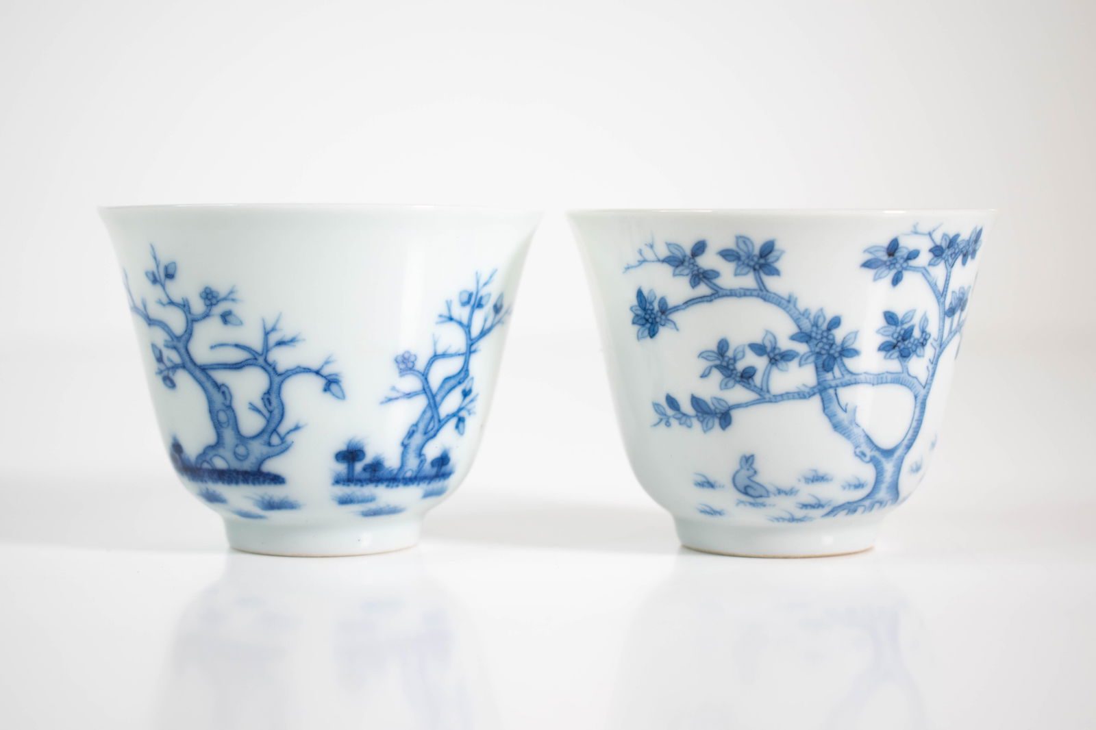 Chinese Blue and White Cups Kangxi Mark: Small cups each decorated with flowers and characters. The bottoms with concentric circles and a six character Kangxi mark seal Height 2"