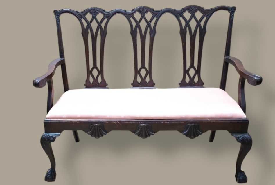 Chippendale Mahogany Settee: A Chippendale settee. Carved ball and claw feet below nicely carved cabriole legs. It has multiple carved shells on the front apron below the slip seat, the top rear crest rail also nicely