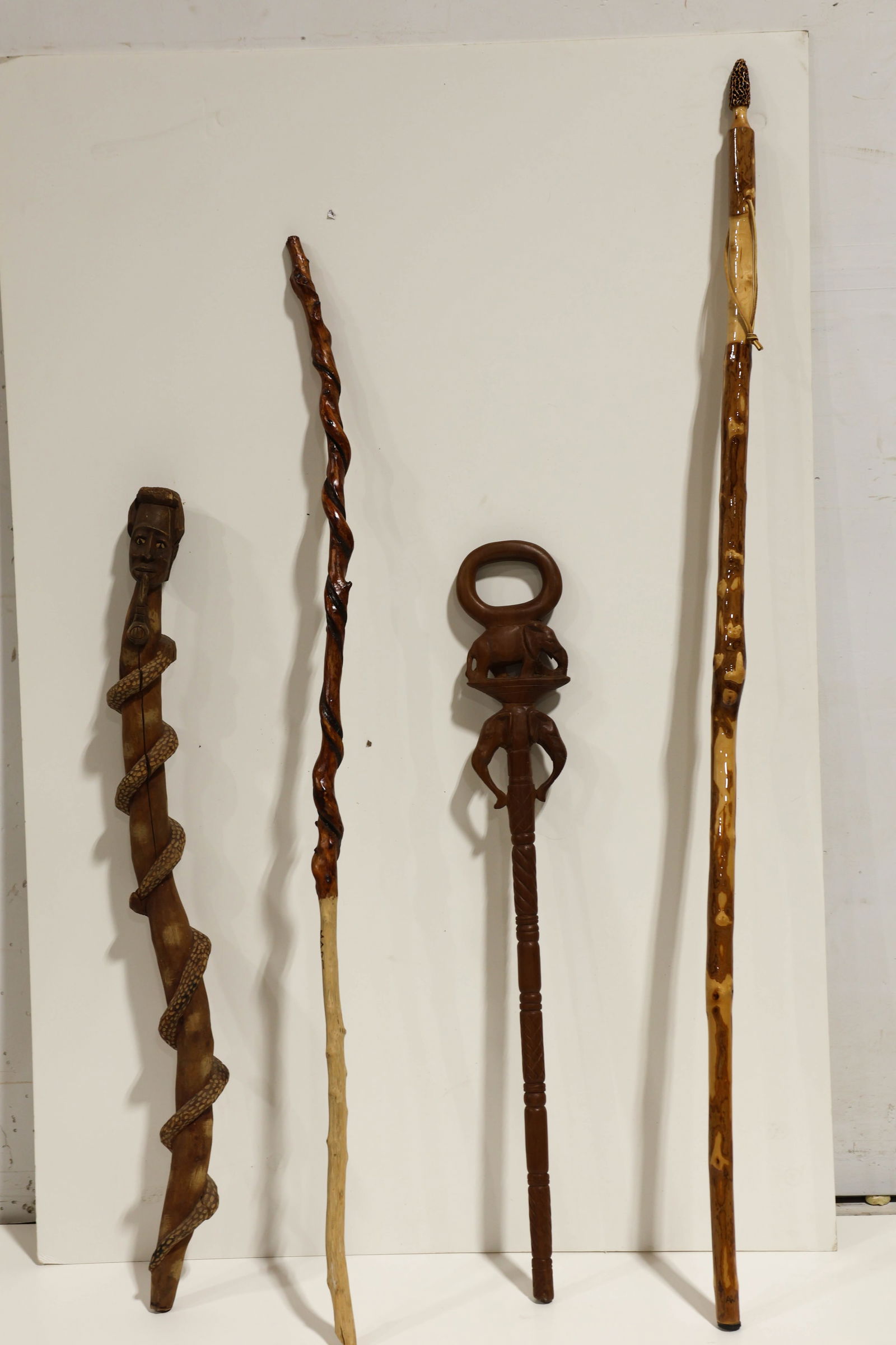 Walking Sticks: Includes African and other carved sticks. (4) Largest measures approx. 59"l ****We Offer In-House Shipping***