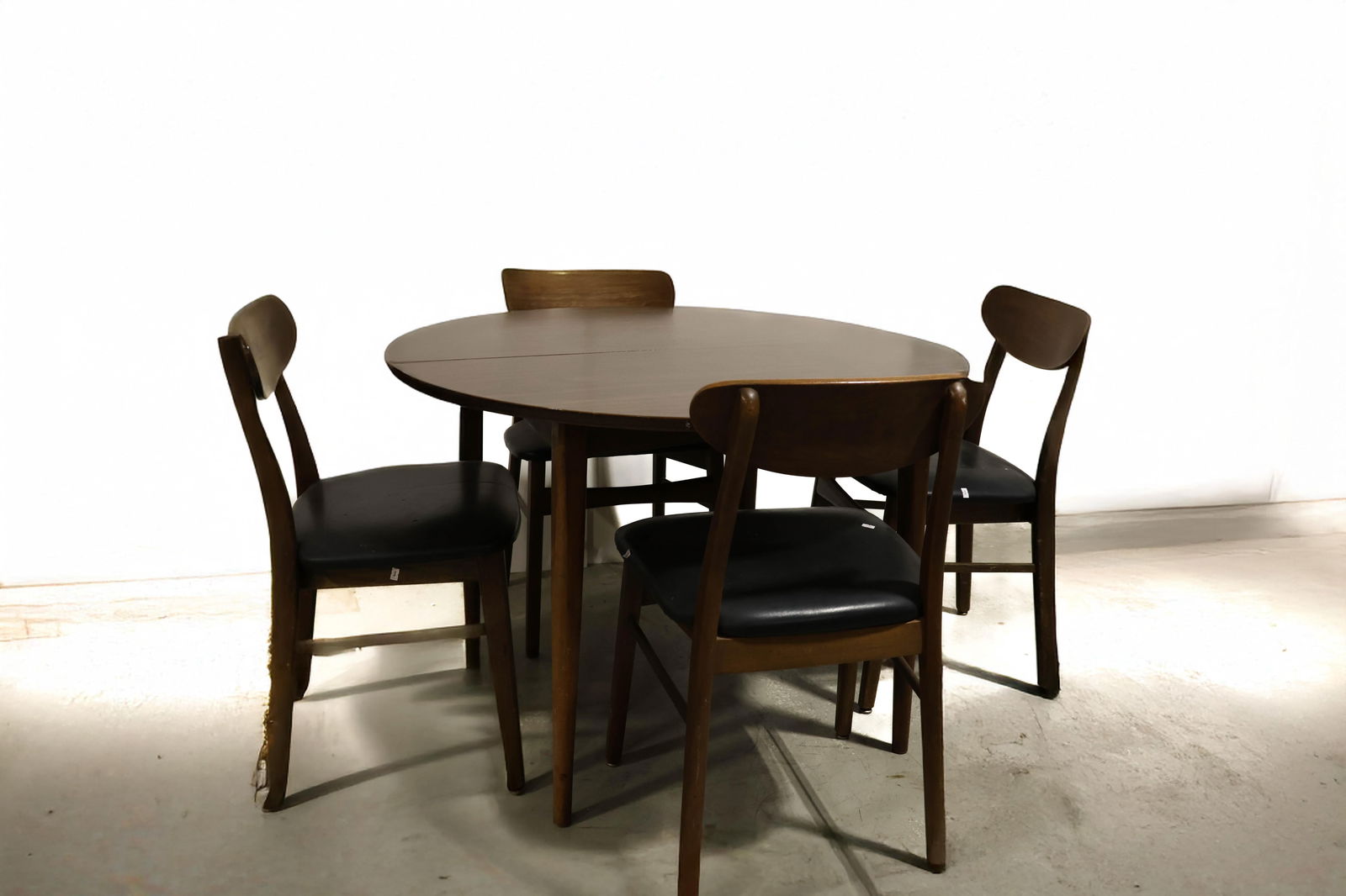 Kosugo Mid Century Modern Dinette Set: Includes a table with a laminated top, four chairs and a table leaf. As found at the estate, needs a good cleaning, polishing or refinishing or can be used as is, overall solid condition chairs