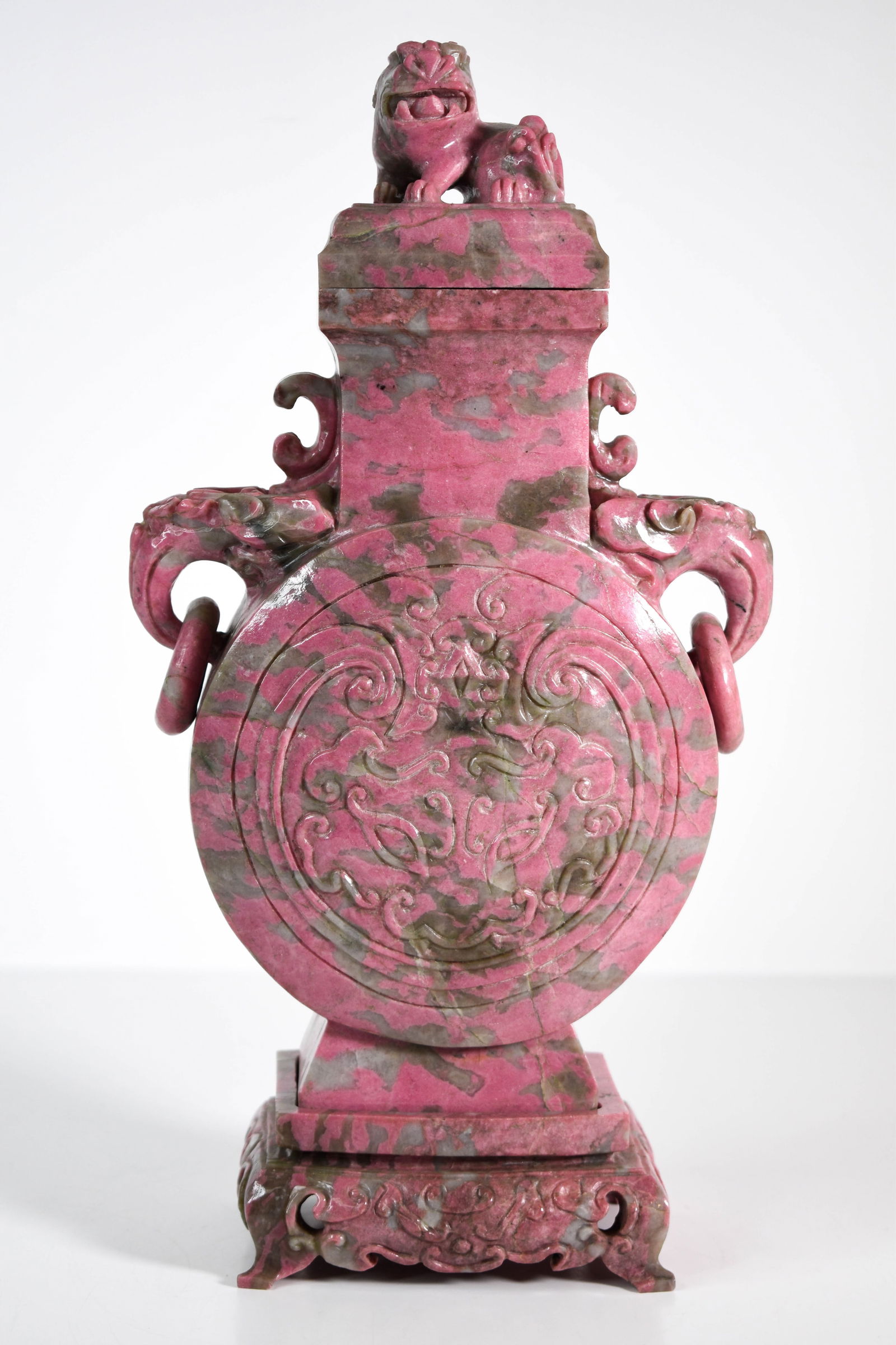 Chinese Sculpted Rhodonite Covered Urn: Nicely done in the form of a moon flask toped with a foo dog or Lion. Hand carved Rhodonite or Unikite Jasper. Height 14" ****We Offer In-House Shipping***