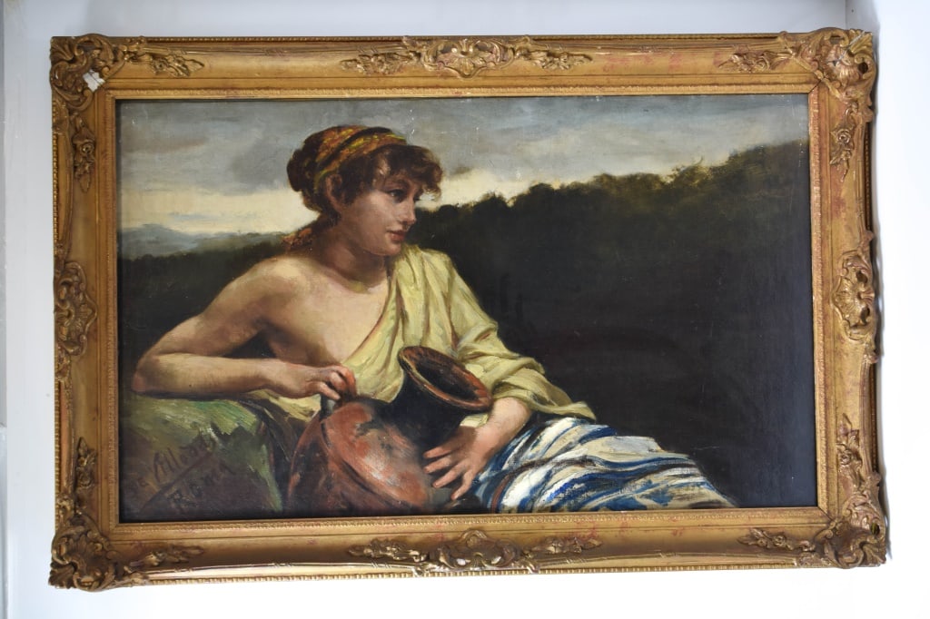 Ricardo Villodas y de la Torre Oil on Canvas 1891: A finely executed oil on canvas of great subject matter depicting a seated young woman holding an earthenware amphora against a darkened landscape. The sitter's expression is contemplative, rendered w