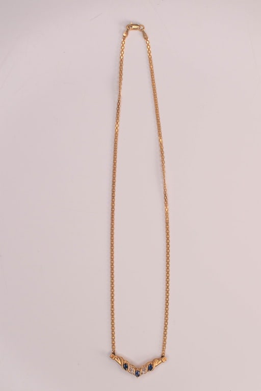 10K Gold, Diamond & Sapphire Necklace 16" 4.9 Gram: 3 marquise cut blue sapphires apx. 4mm x 3mm each, 4 diamond accents