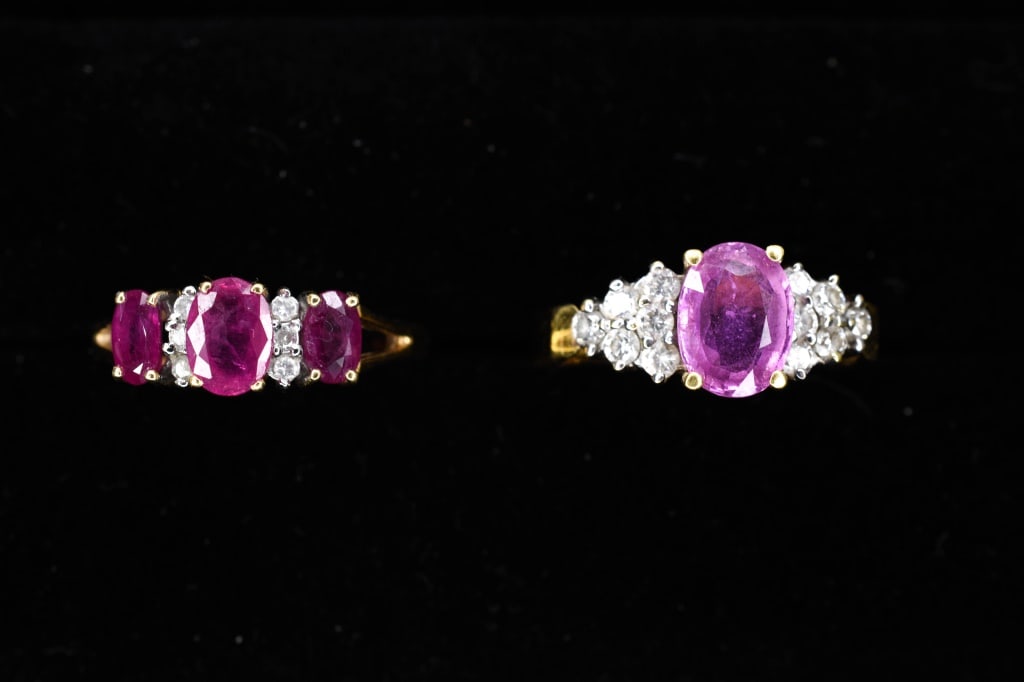 18K Gold, Diamond & Pink Sapphire Ring: 18K gold ring centered with an oval pink sapphire apx 8mm x 6mm flanked by 12 full cut diamonds apx 0.03ct each