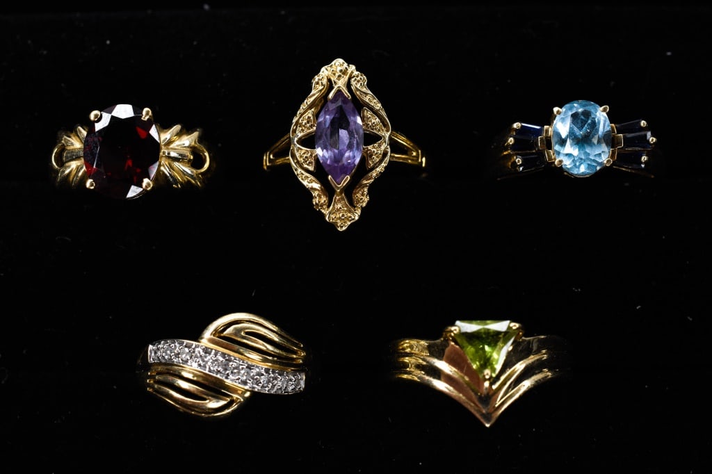 10K Gold Rings Collection: band with 9 single cut accent diamonds; apx 8mm x 10mm oval garnet; apx 10mm x 5mm marquise cut syn color change sapphire; apx 6mm x 6mm triangular peridot; 8mm x 6mm oval blue topaz flanked by 6