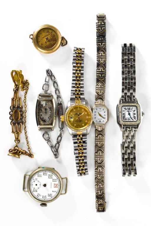 Watches and a Watch Fob, Sterling, & More: Gold filled ornate watch fob; faux lady's Rolex; Cartier with rhinestones, sterling Geneve; silver plated Gruen; and others.