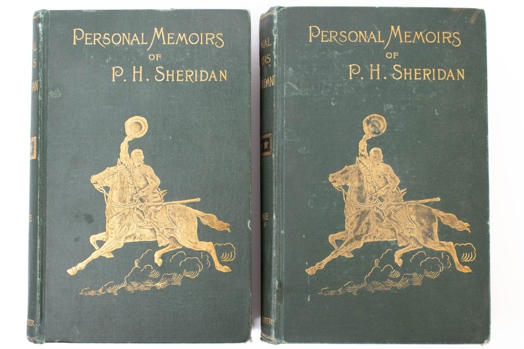 1888 Vol 1 & 2 Personal Memoirs of P F Sheridan: Published by Charles Webster in 1888. 500 and 486 pages. Some light wear from display. Thumbed through quickly, appears to be no loose pages. Both volumes have a ink block stamped from the original ow