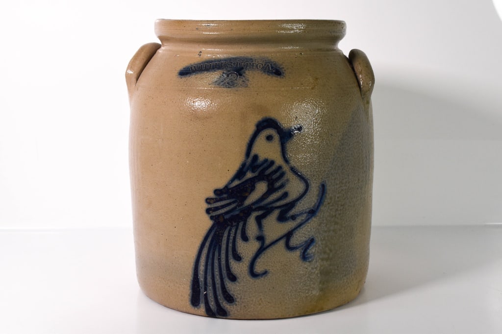 Whites Utica 2 Gallon Blue Bird Decorated: Stoneware Crock; No lid. Stamped Whites Utica 2. Some chips out of the handles. Decoration is nice and bright. Few chips out of the bottom. 10.5 inches tall. No apparent cracks or breaks. Slightly dis