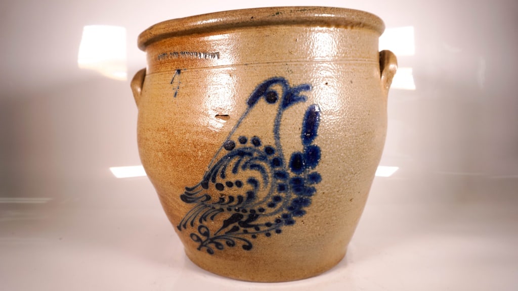 White Blue Decorated Bird Stoneware Crock: Stamped N White & Co Binghamton 4. Chips on the inside top rim. Right handle has a few chips on it. Some discoloration. Blow out by the birds neck. Glazed over chip in the birds wing. Looked over it q