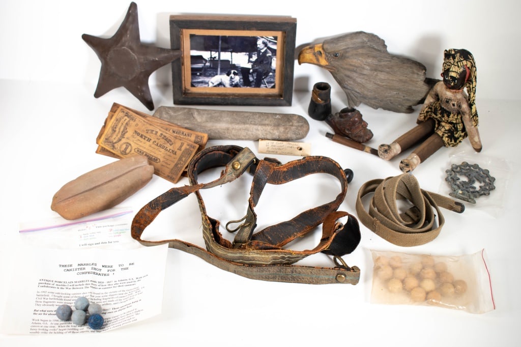Various Civil War Relics & Various Items: 2 bags of unknown Providence musket balls,2 stones 1 square and the other with a deep groove in it. Wax Stamp with the letter I or L. Modern copy of Custer with his dog in a camp. Comic book copies of