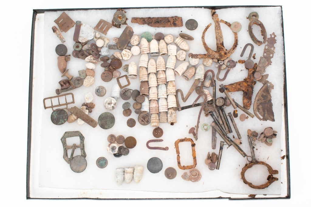 Various Dug Items: No info is known on where these items came from. Various 1800s US army uniform buttons, 1944 nickel, 1770s British coin, horse bridle parts,rifle barrel ring, various bullets and other relics in a rik
