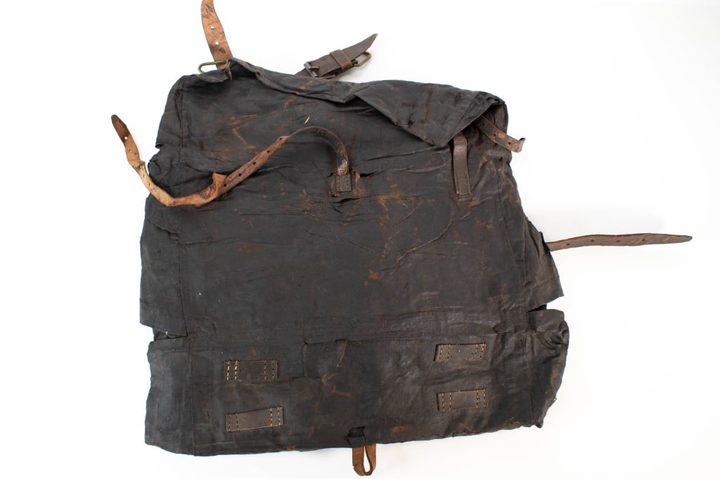 Early Leather & Oil Cloth Backpack 1700s-1800s: Brittle from age. Rips and tears on the edges. Relic condition. Leather straps. Provenance: Acquired from a single owner private estate collection originating in Gettysburg, Pennsylvania. The
