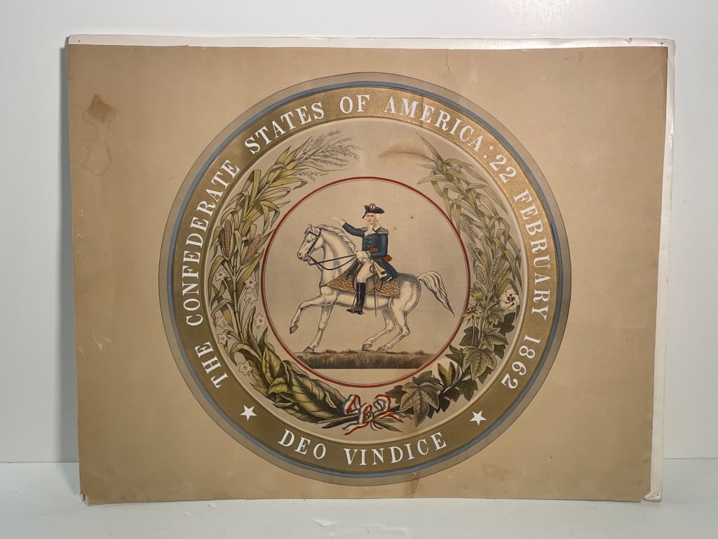 Confederate States of America Print 1862: Print featuring the seal of the Confederate States of America dated February 22, 1862. Depicts a central figure on horseback surrounded by foliage and the motto 'Deo Vindice.' Measures 29 W x 23 H.